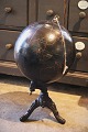 Decorative, 
antique globe 
in black on an 
iron base for 
...