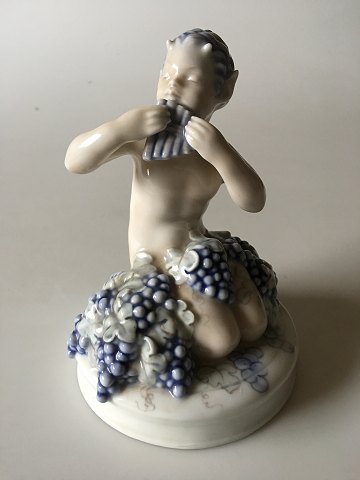 Royal Copenhagen 2171 RC Faun kneeling with grapes Storch 1921 16 x 11 cm Pan. 
In mint and nice condition