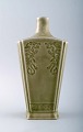 Chinese ceramic vase in celadon glaze with dragon motifs.
