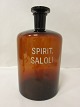 Pharmacy bottle with text and a stopper
Text: "SPIRIT. SALOLI"
Presumably from Gråsten Apotek, Denmark (Gråsten 
Pharmacy)
H.: 27,5cm incl. the stopper
Please note: Chip in the stopper