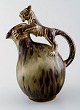 Royal Copenhagen Bode Willumsen stoneware jug modeled with mythical creatures.