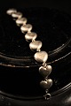 Old children bracelet in silver in the form of little hearts with "Anne Marie" 
engraved...