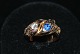 Antik Huset 
presents: 

Snake Ring 
with Diamond 
and Sapphire, 
14 Karat Gold
Size: 56
