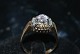 Antik Huset 
presents: 
Gold ring 
with purple 
stone and 
Diamonds 14 
karat
Ring size 62