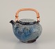 L'Art presents: 
Gutte 
Eriksen, 
Denmark.
Unique ceramic 
teapot, raku 
technique.