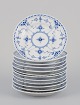 L'Art presents: 
Royal 
Copenhagen Blue 
Fluted Half 
Lace, a set of 
twelve plates.