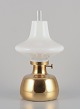 L'Art presents: 
Henning 
Koppel for 
Louis Poulsen. 
Petronella oil 
lamp in brass 
with opal glass 
shade.