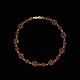 Bestik.dk 
presents: 
Hermann 
Siersbøl. 14k 
Gold Bracelet 
with Garnets.