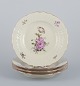 L'Art presents: 
Royal 
Copenhagen 
"Frijsenborg". 
Four dinner 
plates in 
hand-painted 
porcelain.