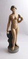 Royal 
Copenhagen. 
Porcelain 
figure. 
Standing naked 
woman ...
