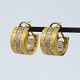 Antik 
Damgaard-
Lauritsen 
presents: 
C. 
Antonsen; Ear 
rings of 18k 
gold and white 
gold
