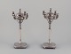 A pair of large and impressive Italian candlesticks in silver.