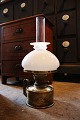 K&Co. presents: 
Old 
kerosene lamp 
in brass with 
white opal 
glass 
lampshade...