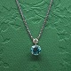 Antik 
Damgaard-
Lauritsen 
presents: 
Necklace 
of 14k white 
gold set with a 
turquoise 
zircon and 
diamond