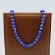 Antik 
Damgaard-
Lauritsen 
presents: 
Long 
necklace of 
lapis lazuli 
with clasp of 
14k gold