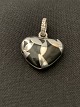 Antik Huset 
presents: 
Heart 
pendant in 
silver.
Stamped 925S
Length with 
eaves. 2.3 cm