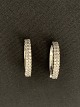 Antik Huset 
presents: 
Earrings 
in silver, with 
inlaid clear 
stones.
Height 2.1 cm
