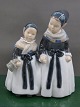Antikkram 
presents: 
Royal 
Copenhagen 
Denmark, 
figurine No 
1316, Pair of 
Amager Girls 
shopping.
