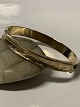 Antik Huset 
presents: 
14 carat 
bangle with 
chisels.