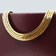 Antik 
Damgaard-
Lauritsen 
presents: 
Alf 
Sørensen; A 
wide geneve 
necklace of 14k 
gold