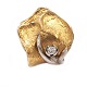 Aabenraa 
Antikvitetshandel 
presents: 
Ole 
Lynggaard clasp 
14kt gold with 
a diamond of 
ca. 0,07ct. 
Size: 20x18mm