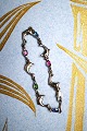 K&Co. presents: 
Nice 
children's 
bracelet in 
silver with 
small dolphins 
and colored 
stones...