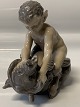 Antik Huset 
presents: 
Royal 
Copenhagen, 
figure Pan on 
bear Chr 
Thomsen.