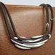 Antik 
Damgaard-
Lauritsen 
presents: 
Georg 
Jensen, Anette 
Kræn; Necklace 
in sterling 
silver with 
leather #310
