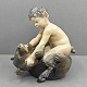 Antik 
Damgaard-
Lauritsen 
presents: 
Royal 
Copenhagen; 
Figurine of 
porcelain, a 
faun with a 
bear #648