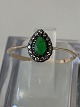 Antik Huset 
presents: 
Women's 
ring in 14 
carat gold, 
with green 
emerald and 
white stones. 
Size 56.5