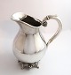 Lundin Antique 
presents: 
Svend 
Toxvärd. 
Sterling silver 
pitcher with 
grapes, 
hammered. 
Height 18 cm.