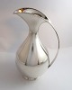 Lundin Antique 
presents: 
Michelsen. 
Sterling silver 
jug 
&#8203;&#8203;(925).
 Design Kay 
Fisker. Height 
24 cm. ...