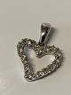 Antik Huset 
presents: 
Pendant 14 
carat white 
gold, shaped 
like a heart
with diamonds.