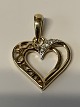 Antik Huset 
presents: 
Pendant 14 
carat gold, 
designed as a 
Heart
with clear 
stones.