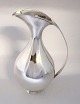 Lundin Antique 
presents: 
Michelsen. 
Sterling silver 
jug 
&#8203;&#8203;(925).
 Design Kay 
Fisker. Height 
24 cm. ...