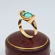 Antik 
Damgaard-
Lauritsen 
presents: 
Hans 
Hansen; A ring 
of 14k gold 
with turquoise