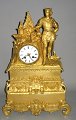 Pegasus – Kunst 
- Antik - 
Design 
presents: 
French 
Empire table 
clock of gilt 
bronze, 19th 
century.