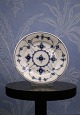 K&Co. presents: 
Royal 
Copenhagen Blue 
Fluted Plain 
Bread Plate / 
Dessert Plate. 
Dia.: 14cm. 
RC#1/331.
Before ...