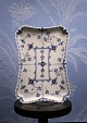 K&Co. presents: 
Royal 
Copenhagen Blue 
Fluted Full 
Lace Tray. 
RC#1/1195. 
From 
1923-28...