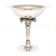 Aabenraa 
Antikvitetshandel 
presents: 
Georg 
Jensen very 
large 
sterlingsilver 
grape tazza 
264B. H: 31cm. 
W: ...