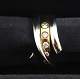 Lundin Antique 
presents: 
Georg 
Jensen. Magic 
ring white & 
red gold 18K 
with 5 
brilliant-cut 
diamonds (750). 
...