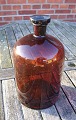 Antikkram 
presents: 
Large and 
well-maintained 
5 liter 
apothecary 
bottle in dark 
brown glass.