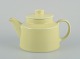 L'Art presents: 
Arabia, 
Finland.
Retro teapot 
in yellow 
stoneware.