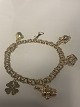 Antik Huset 
presents: 
Bismark 
Bracelet with 6 
charms, 14 
Karat Gold
Length: 19 cm.