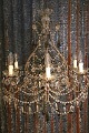 K&Co. presents: 
Old French 
prism 
chandelier, 
decorated with 
lots of clear 
glass prisms, 
chains and 
glass beads...