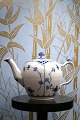 K&Co. presents: 
Rare Royal 
Copenhagen Blue 
Fluted Half 
Lace Teapot. 
1/610...