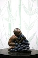 K&Co. presents: 
Kai 
Nielsen glazed 
ceramic 
figurine of a 
boy eating 
grapes...