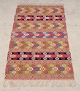 L'Art presents: 
Swedish 
textile artist.
Handwoven wool 
tapestry.
Multicolored.