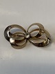 Antik Huset 
presents: 

8 Karat 
gold, brooch 
with clear 
stone
Measures 3.6 x 
1.9 cm.