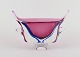 L'Art presents: 
Murano, 
Italy. 
Decorative 
"Sommerso" 
glass vase with 
handles.
In violet, 
clear, and blue 
art ...